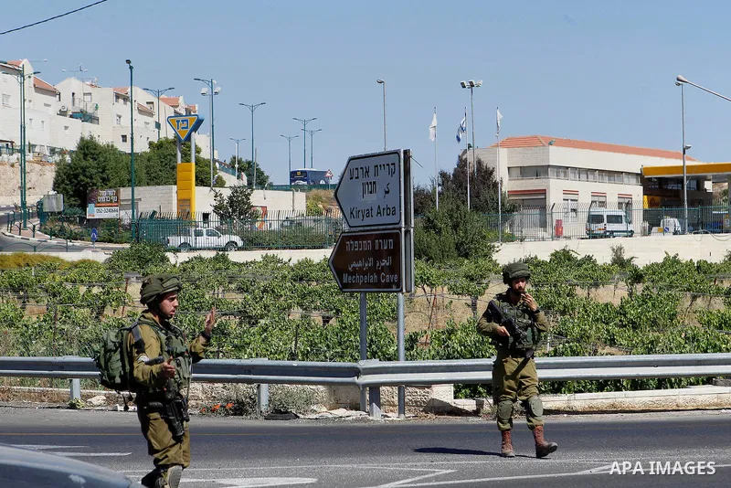 Israeli security forces gather near the scene of what the Israeli military said was an attack by Palestinian in the Jewish settlement of Kiryat Arba near the West Bank city of Hebron 30 June 2016. Israeli army said the P...