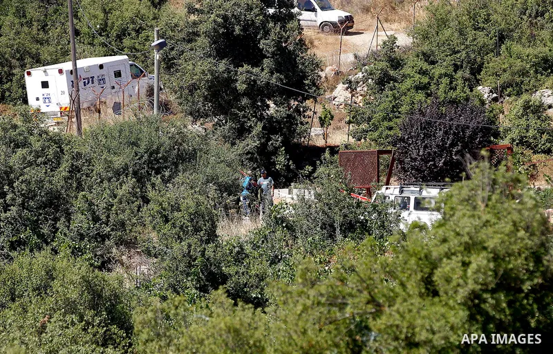 Israeli security forces gather near the scene of what the Israeli military said was an attack by Palestinian in the Jewish settlement of Kiryat Arba near the West Bank city of Hebron 30 June 2016. Israeli army said the P...