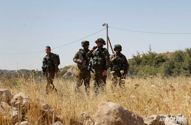 Israeli security forces gather near the scene of what the Israeli military said was an attack by Palestinian in the Jewish settlement of Kiryat Arba near the West Bank city of Hebron 30 June 2016. Israeli army said the P...