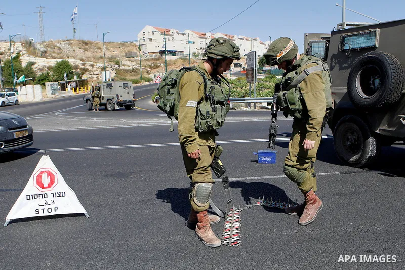 Israeli security forces gather near the scene of what the Israeli military said was an attack by Palestinian in the Jewish settlement of Kiryat Arba near the West Bank city of Hebron 30 June 2016. Israeli army said the P...