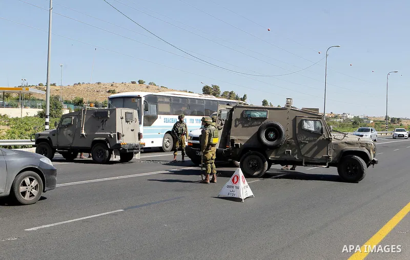 Israeli security forces gather near the scene of what the Israeli military said was an attack by Palestinian in the Jewish settlement of Kiryat Arba near the West Bank city of Hebron 30 June 2016. Israeli army said the P...