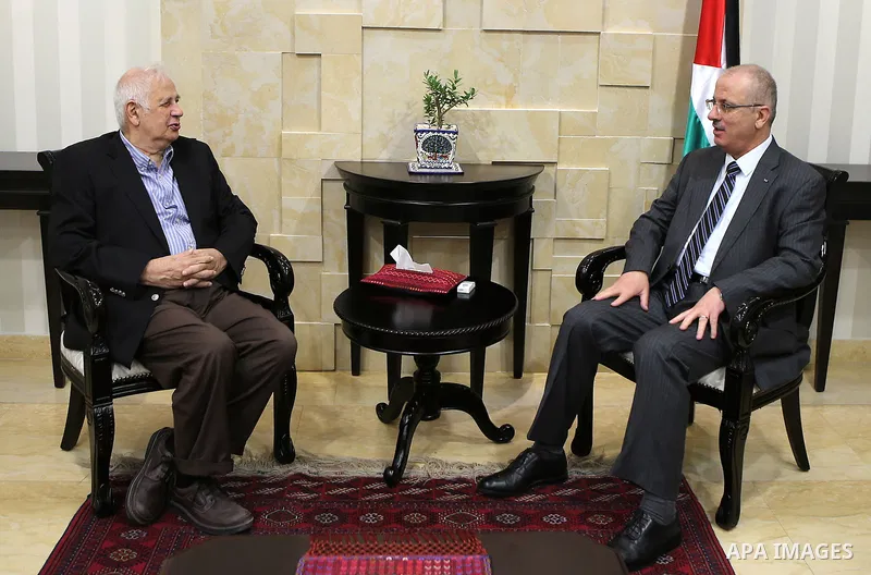 Palestinian prime minister Rami Hamdallah meet with Palestinian Central Elections Commission chief, Hanna Nasser, in the West bank city of Ramallah, on June 30, 2016.. Photo by Prime Minister Office