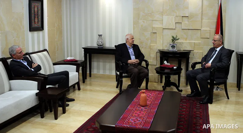 Palestinian prime minister Rami Hamdallah meet with Palestinian Central Elections Commission chief, Hanna Nasser, in the West bank city of Ramallah, on June 30, 2016.. Photo by Prime Minister Office