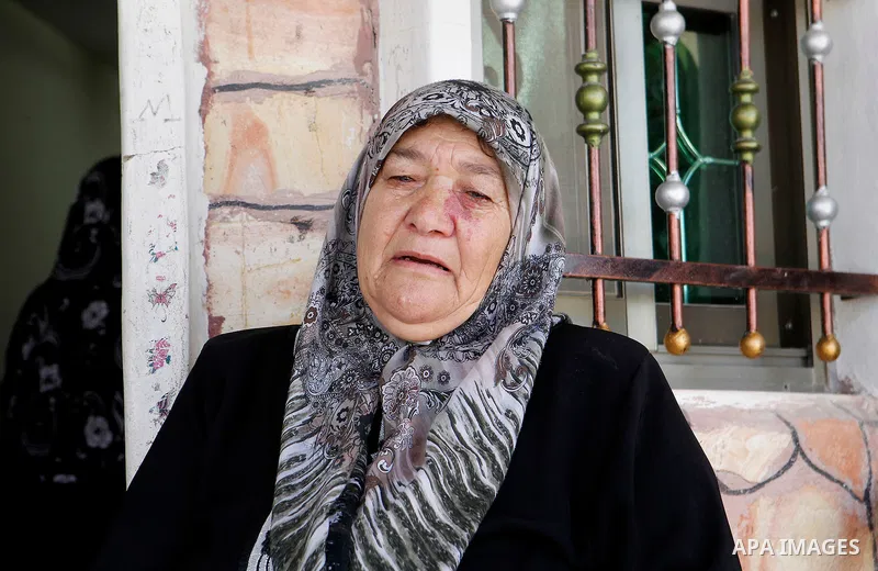 The grandmother of Palestinian Mohammed Nasser Tarayra, who stabbed to death an Israeli teen in a Jewish settlement in the occupied West Bank on June 30,2016 is seen outside her family home in the village of Bani Naim, n...