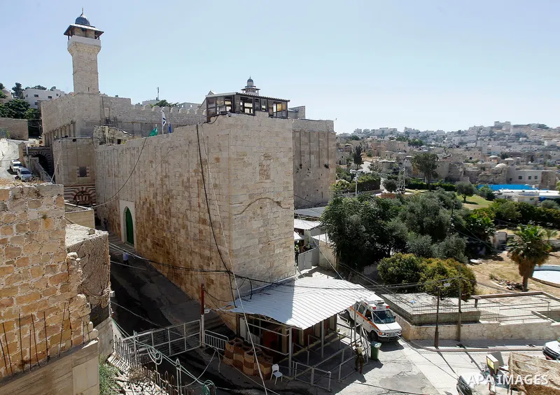 Israeli troops stand guard at the scene where a Palestinian woman who was shot and killed by Israeli border policemen allegedly attempted to carry out a stabbing attack near the Ibrahimi Mosque in the Old City of the sou...