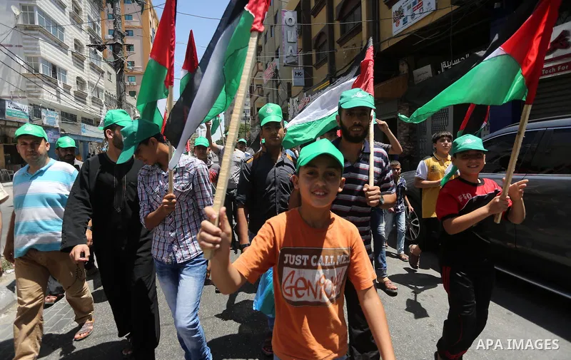 Palestinians take part in a rally marking al-Quds (Jerusalem) Day following Friday prayer in Gaza city on July 1, 2016. Photo by Mohammed Asad