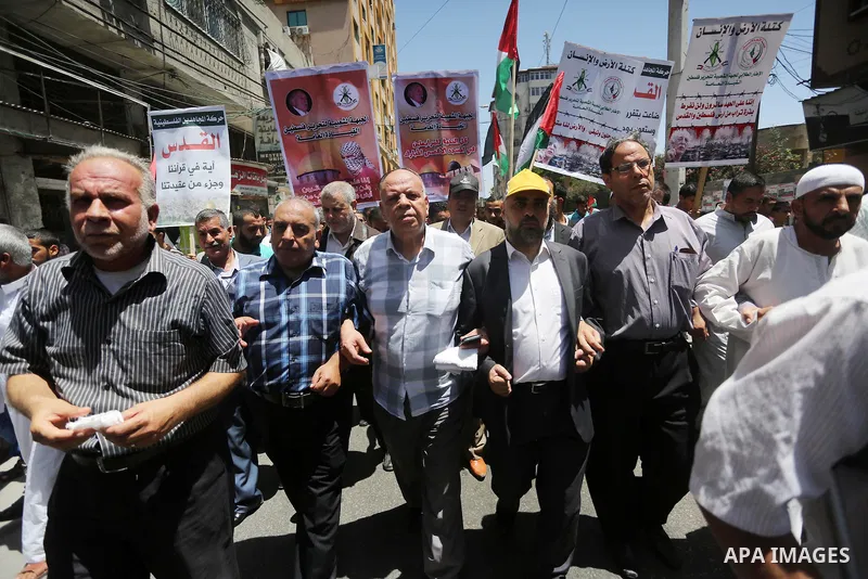 Palestinians take part in a rally marking al-Quds (Jerusalem) Day following Friday prayer in Gaza city on July 1, 2016. Photo by Mohammed Asad