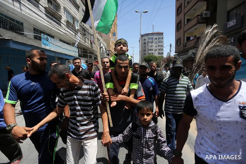 Palestinians take part in a rally marking al-Quds (Jerusalem) Day following Friday prayer in Gaza city on July 1, 2016. Photo by Mohammed Asad