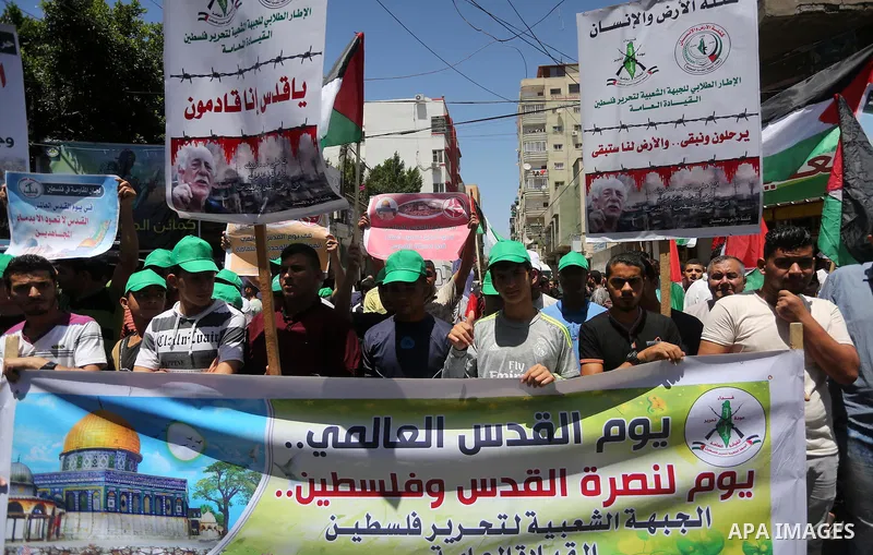 Palestinians take part in a rally marking al-Quds (Jerusalem) Day following Friday prayer in Gaza city on July 1, 2016. Photo by Mohammed Asad