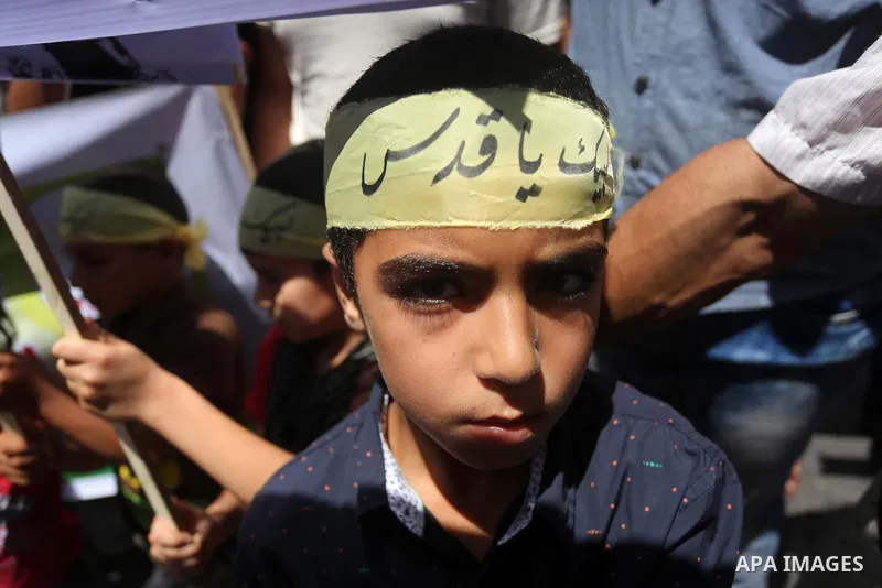 Palestinians take part in a rally marking al-Quds (Jerusalem) Day following Friday prayer in Gaza city on July 1, 2016. Photo by Mohammed Asad