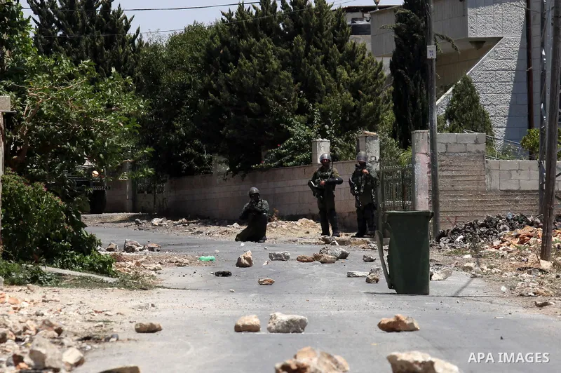 Israeli security forces take position during clashes with Palestinian protesters following a demonstration against the expropriation of Palestinian land by Israel on July 01, 2016 in the village of Kfar Qaddum, near Nabl...