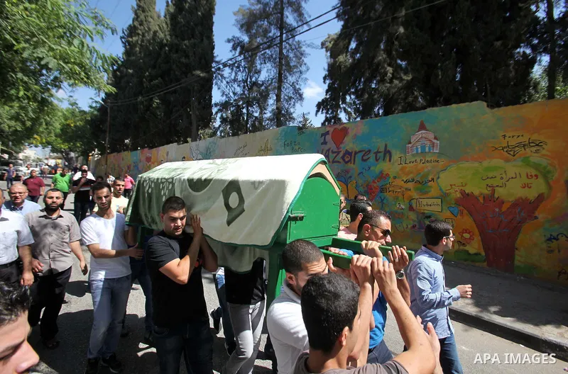 Mourners carry the coffin of Sondos al-Basha, a Palestinian woman who was killed in the Istanbul airport attack blamed on the Islamic State (IS) group on June 28, during her funeral in the West Bank town of Qalqilyah on...