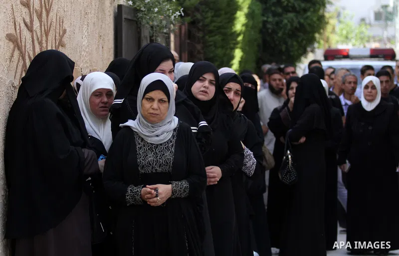 Relatives mourn during the funeral of Sondos al-Basha, a Palestinian woman who was killed in the Istanbul airport attack blamed on the Islamic State (IS) group on June 28, in the West Bank town of Qalqilyah on July 1, 20...
