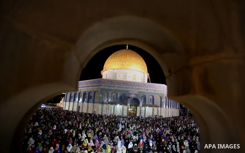 Palestinian muslim worshipers take part in Laylat Al Qadr prayers or Night of Power, in which the Muslim holy book of Koran was revealed to Prophet Mohammad by Allah on the 27th day of the holy fasting month of Ramadan i...