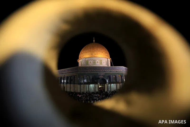 Palestinian muslim worshipers take part in Laylat Al Qadr prayers or Night of Power, in which the Muslim holy book of Koran was revealed to Prophet Mohammad by Allah on the 27th day of the holy fasting month of Ramadan i...