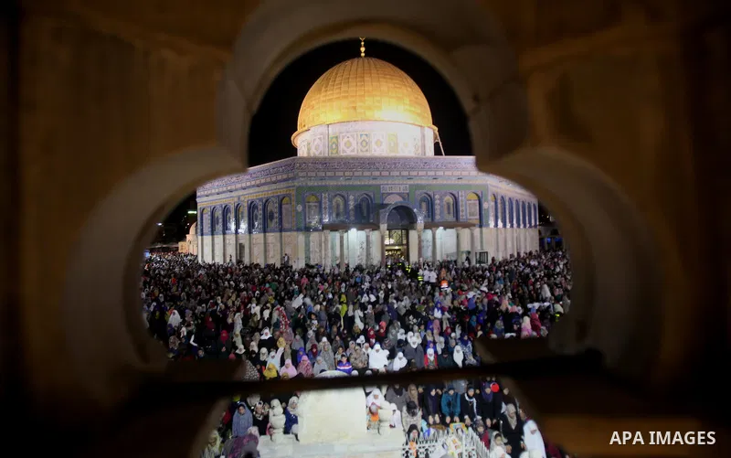 Palestinian muslim worshipers take part in Laylat Al Qadr prayers or Night of Power, in which the Muslim holy book of Koran was revealed to Prophet Mohammad by Allah on the 27th day of the holy fasting month of Ramadan i...