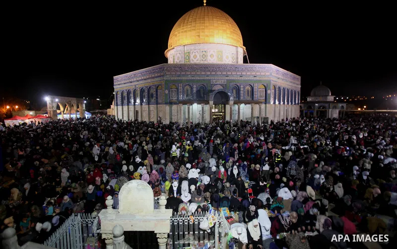 Palestinian muslim worshipers take part in Laylat Al Qadr prayers or Night of Power, in which the Muslim holy book of Koran was revealed to Prophet Mohammad by Allah on the 27th day of the holy fasting month of Ramadan i...