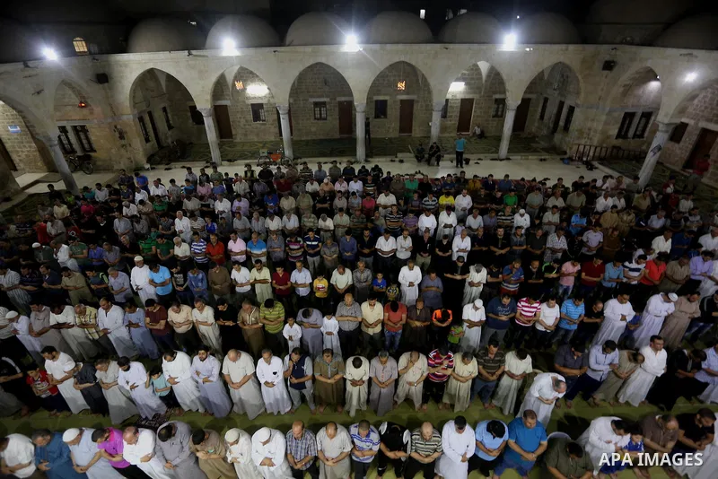 Palestinian Muslim worshippers pray overnight on July 2, 2016 at a Mosque in Gaza city on the occasion of Laylat al-Qadr which falls on the 27th day of the fasting month of Ramadan. Laylat al-Qadr, or Night of Destiny, m...