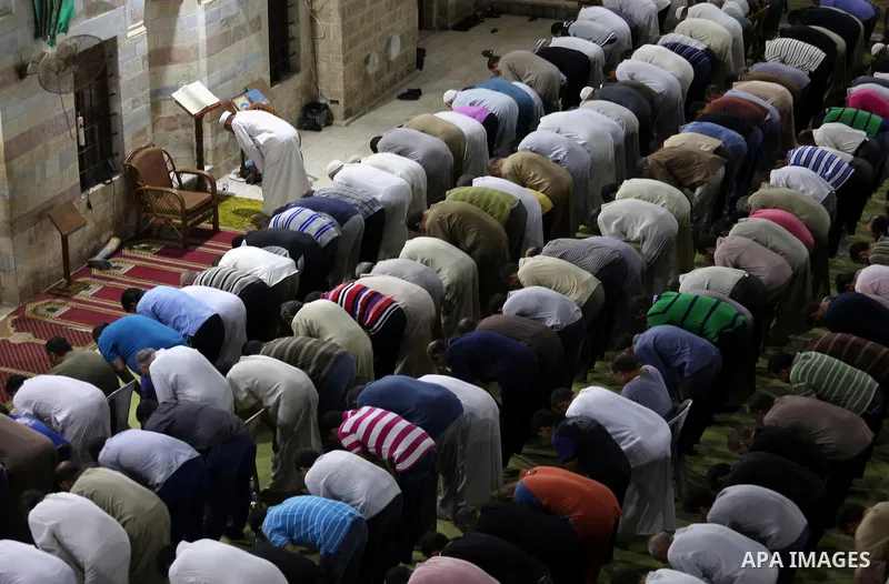 Palestinian Muslim worshippers pray overnight on July 2, 2016 at a Mosque in Gaza city on the occasion of Laylat al-Qadr which falls on the 27th day of the fasting month of Ramadan. Laylat al-Qadr, or Night of Destiny, m...
