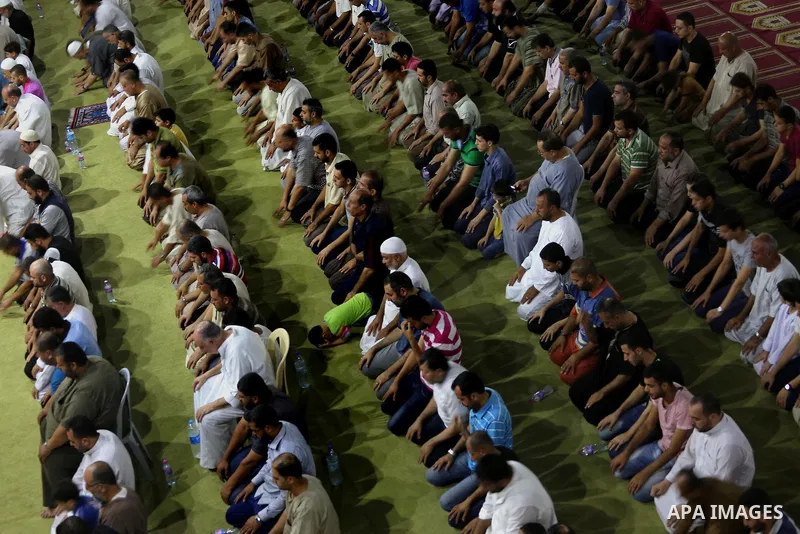 Palestinian Muslim worshippers pray overnight on July 2, 2016 at a Mosque in Gaza city on the occasion of Laylat al-Qadr which falls on the 27th day of the fasting month of Ramadan. Laylat al-Qadr, or Night of Destiny, m...