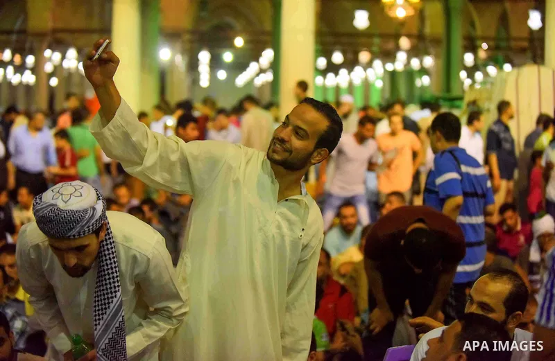 Egyptian muslim worshipers take part in Laylat Al Qadr prayers or Night of Power, in which the Muslim holy book of Koran was revealed to Prophet Mohammad by Allah on the 27th day of the holy fasting month of Ramadan at A...