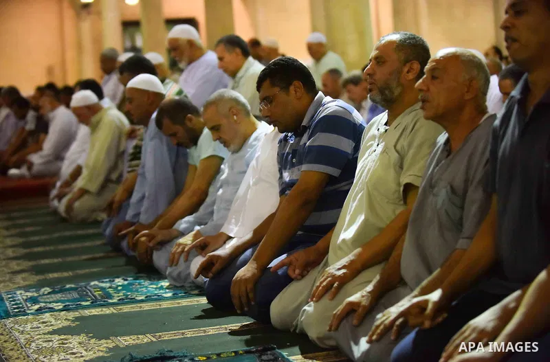 Egyptian muslim worshipers take part in Laylat Al Qadr prayers or Night of Power, in which the Muslim holy book of Koran was revealed to Prophet Mohammad by Allah on the 27th day of the holy fasting month of Ramadan at A...