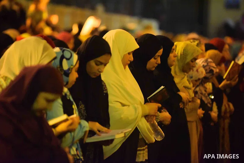 Egyptian muslim worshipers take part in Laylat Al Qadr prayers or Night of Power, in which the Muslim holy book of Koran was revealed to Prophet Mohammad by Allah on the 27th day of the holy fasting month of Ramadan at A...