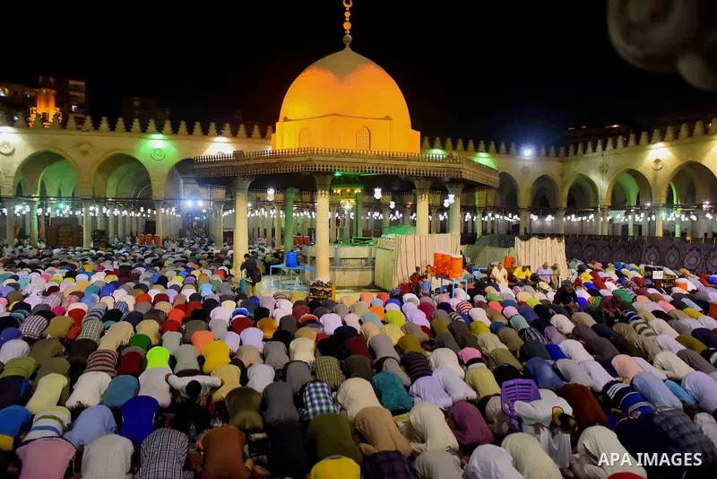 Egyptian muslim worshipers take part in Laylat Al Qadr prayers or Night of Power, in which the Muslim holy book of Koran was revealed to Prophet Mohammad by Allah on the 27th day of the holy fasting month of Ramadan at A...
