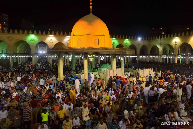 Egyptian muslim worshipers take part in Laylat Al Qadr prayers or Night of Power, in which the Muslim holy book of Koran was revealed to Prophet Mohammad by Allah on the 27th day of the holy fasting month of Ramadan at A...