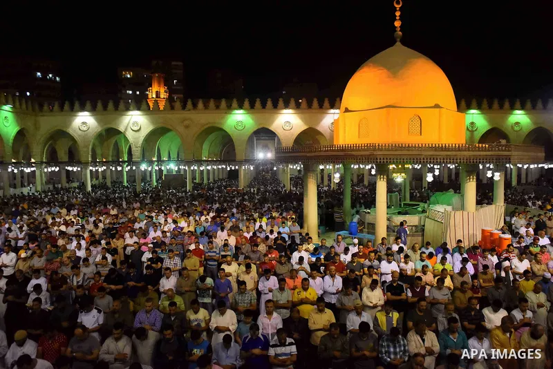 Egyptian muslim worshipers take part in Laylat Al Qadr prayers or Night of Power, in which the Muslim holy book of Koran was revealed to Prophet Mohammad by Allah on the 27th day of the holy fasting month of Ramadan at A...