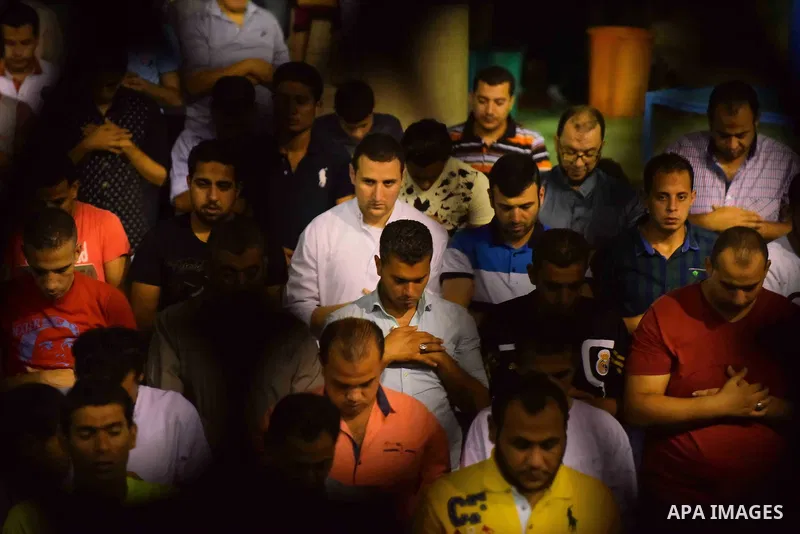 Egyptian muslim worshipers take part in Laylat Al Qadr prayers or Night of Power, in which the Muslim holy book of Koran was revealed to Prophet Mohammad by Allah on the 27th day of the holy fasting month of Ramadan at A...