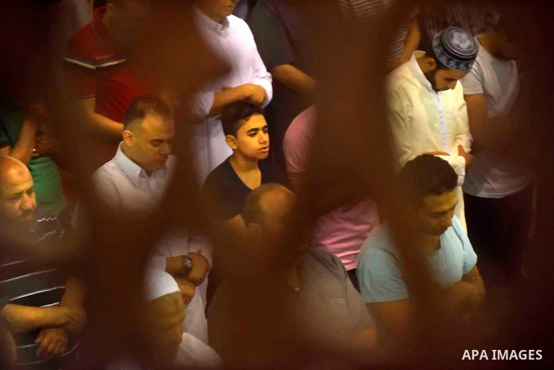 Egyptian muslim worshipers take part in Laylat Al Qadr prayers or Night of Power, in which the Muslim holy book of Koran was revealed to Prophet Mohammad by Allah on the 27th day of the holy fasting month of Ramadan at A...