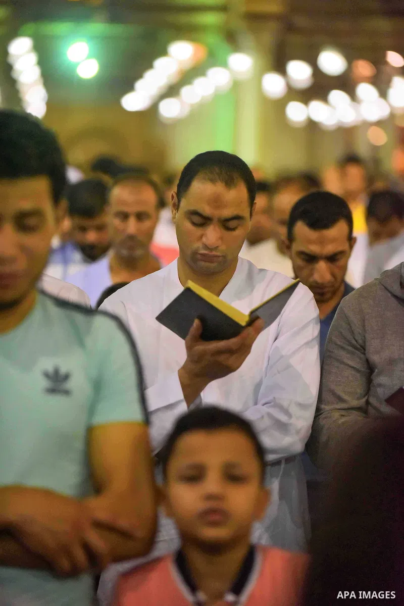 Egyptian muslim worshipers take part in Laylat Al Qadr prayers or Night of Power, in which the Muslim holy book of Koran was revealed to Prophet Mohammad by Allah on the 27th day of the holy fasting month of Ramadan at A...
