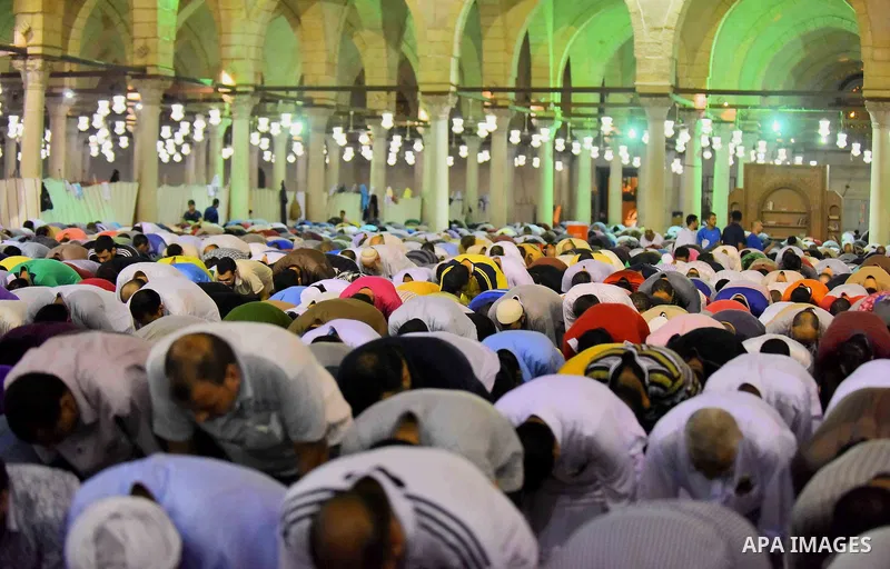 Egyptian muslim worshipers take part in Laylat Al Qadr prayers or Night of Power, in which the Muslim holy book of Koran was revealed to Prophet Mohammad by Allah on the 27th day of the holy fasting month of Ramadan at A...