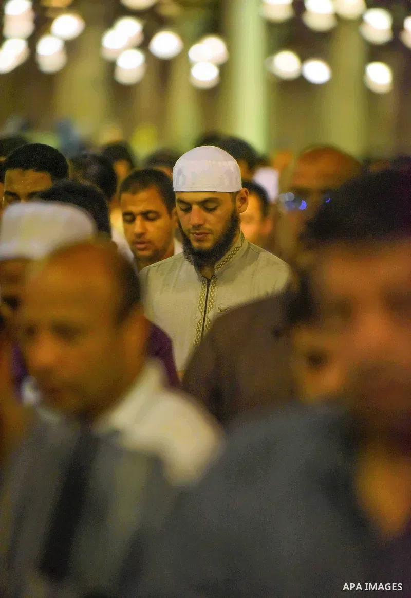 Egyptian muslim worshipers take part in Laylat Al Qadr prayers or Night of Power, in which the Muslim holy book of Koran was revealed to Prophet Mohammad by Allah on the 27th day of the holy fasting month of Ramadan at A...