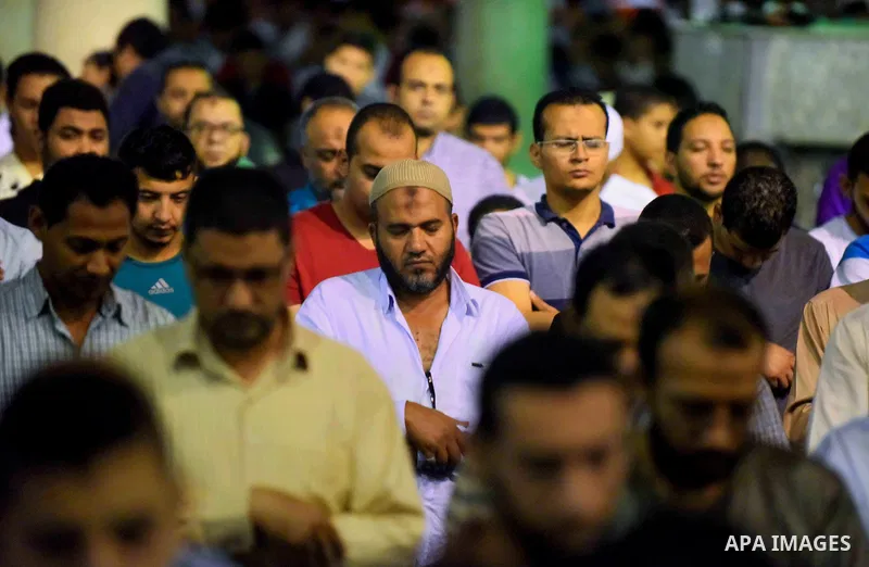 Egyptian muslim worshipers take part in Laylat Al Qadr prayers or Night of Power, in which the Muslim holy book of Koran was revealed to Prophet Mohammad by Allah on the 27th day of the holy fasting month of Ramadan at A...