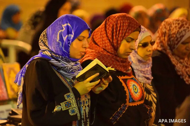 Egyptian muslim worshipers take part in Laylat Al Qadr prayers or Night of Power, in which the Muslim holy book of Koran was revealed to Prophet Mohammad by Allah on the 27th day of the holy fasting month of Ramadan at A...