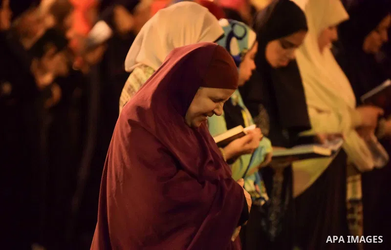 Egyptian muslim worshipers take part in Laylat Al Qadr prayers or Night of Power, in which the Muslim holy book of Koran was revealed to Prophet Mohammad by Allah on the 27th day of the holy fasting month of Ramadan at A...