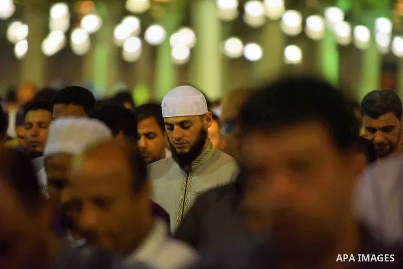 Egyptian muslim worshipers take part in Laylat Al Qadr prayers or Night of Power, in which the Muslim holy book of Koran was revealed to Prophet Mohammad by Allah on the 27th day of the holy fasting month of Ramadan at A...