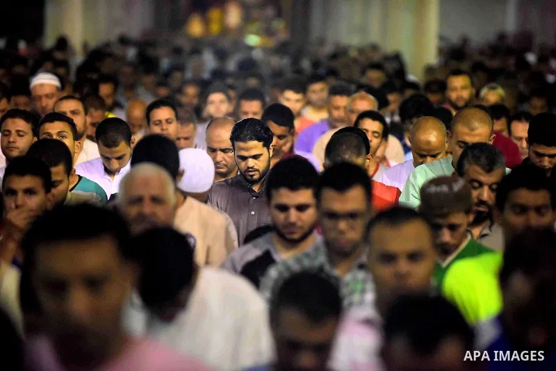 Egyptian muslim worshipers take part in Laylat Al Qadr prayers or Night of Power, in which the Muslim holy book of Koran was revealed to Prophet Mohammad by Allah on the 27th day of the holy fasting month of Ramadan at A...