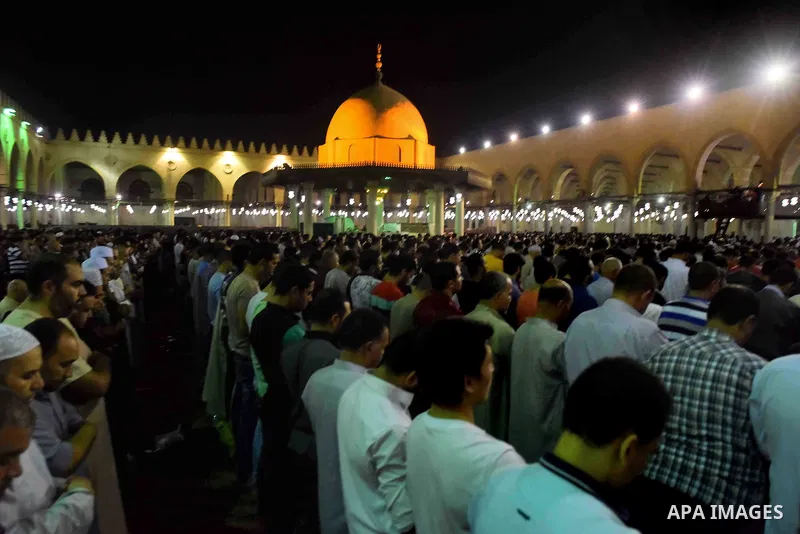 Egyptian muslim worshipers take part in Laylat Al Qadr prayers or Night of Power, in which the Muslim holy book of Koran was revealed to Prophet Mohammad by Allah on the 27th day of the holy fasting month of Ramadan at A...