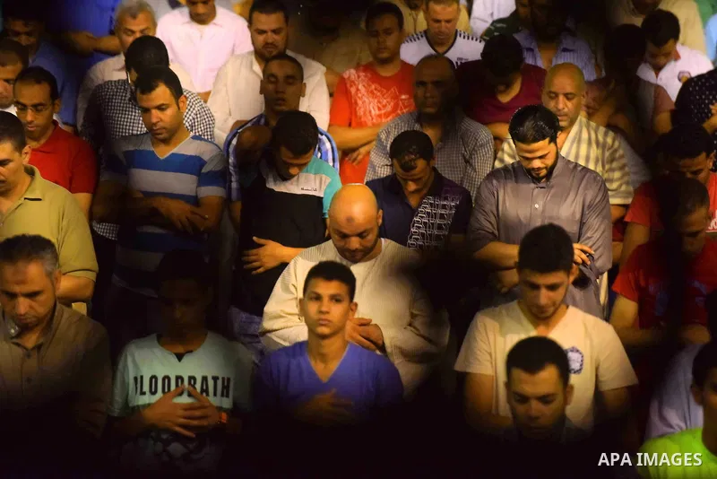 Egyptian muslim worshipers take part in Laylat Al Qadr prayers or Night of Power, in which the Muslim holy book of Koran was revealed to Prophet Mohammad by Allah on the 27th day of the holy fasting month of Ramadan at A...