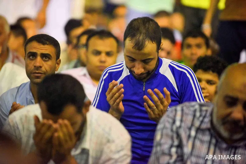 Egyptian muslim worshipers take part in Laylat Al Qadr prayers or Night of Power, in which the Muslim holy book of Koran was revealed to Prophet Mohammad by Allah on the 27th day of the holy fasting month of Ramadan at A...
