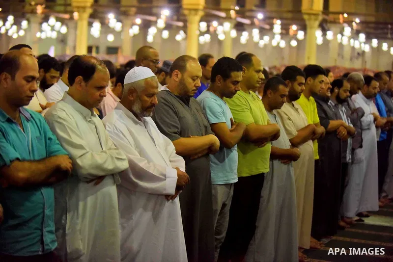 Egyptian muslim worshipers take part in Laylat Al Qadr prayers or Night of Power, in which the Muslim holy book of Koran was revealed to Prophet Mohammad by Allah on the 27th day of the holy fasting month of Ramadan at A...