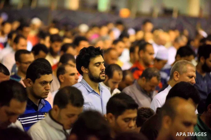 Egyptian muslim worshipers take part in Laylat Al Qadr prayers or Night of Power, in which the Muslim holy book of Koran was revealed to Prophet Mohammad by Allah on the 27th day of the holy fasting month of Ramadan at A...