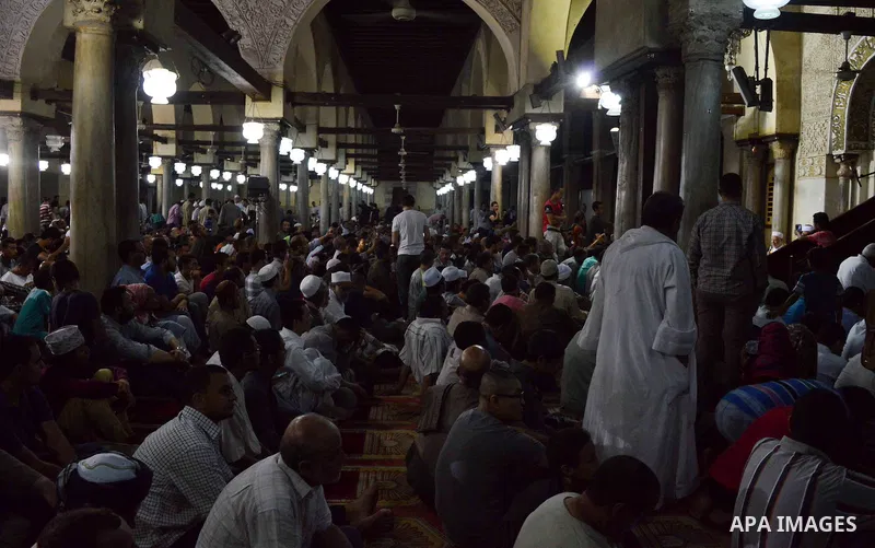 Egyptian muslim worshipers take part in Laylat Al Qadr prayers or Night of Power, in which the Muslim holy book of Koran was revealed to Prophet Mohammad by Allah on the 27th day of the holy fasting month of Ramadan at A...