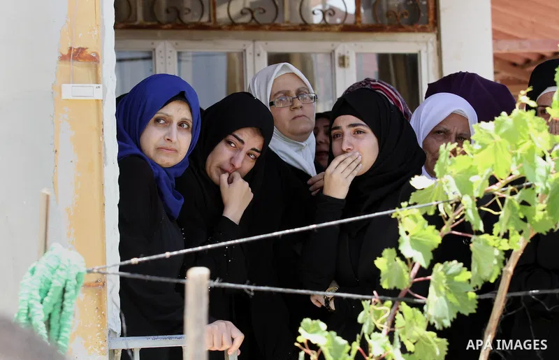Relatives of Palestinian Tayseer Habash, who died from tear gas fired by Israeli security forces during clashes, mourn during his funeral on July 2, 2016 in the West Bank city of Nablus. Habash, 63, died on July 1, 2016...