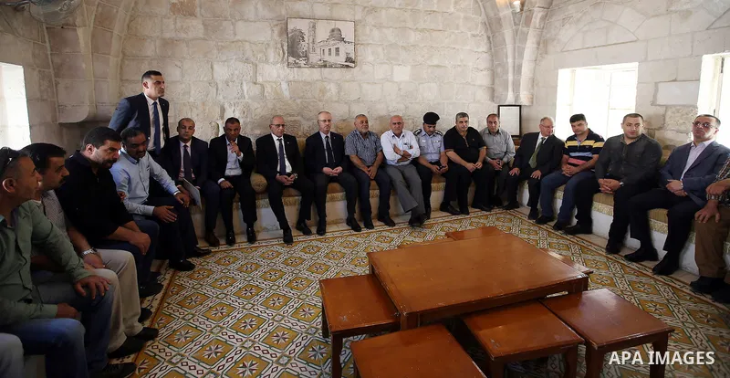 Palestinian Prime Minister Rami Hamdallah visits the mourning tent of Tayseer Habash, who died from tear gas fired by Israeli security forces during clashes, in the West Bank city of Nablus, on July 03, 2016. Photo by Pr...