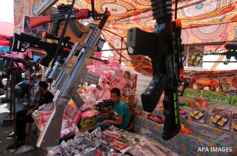 Palestinians shop at a market ahead of the Eid al-Fitr holiday, in Gaza city, on July 4, 2016. Eid al-Fitr marks the end of Muslim's holy fasting month of Ramadan when faithfuls abstain from eating, drinking, smoking and...