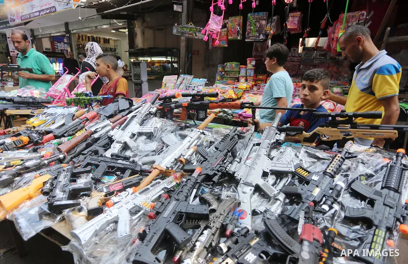 Palestinians shop at a market ahead of the Eid al-Fitr holiday, in Gaza city, on July 4, 2016. Eid al-Fitr marks the end of Muslim's holy fasting month of Ramadan when faithfuls abstain from eating, drinking, smoking and...